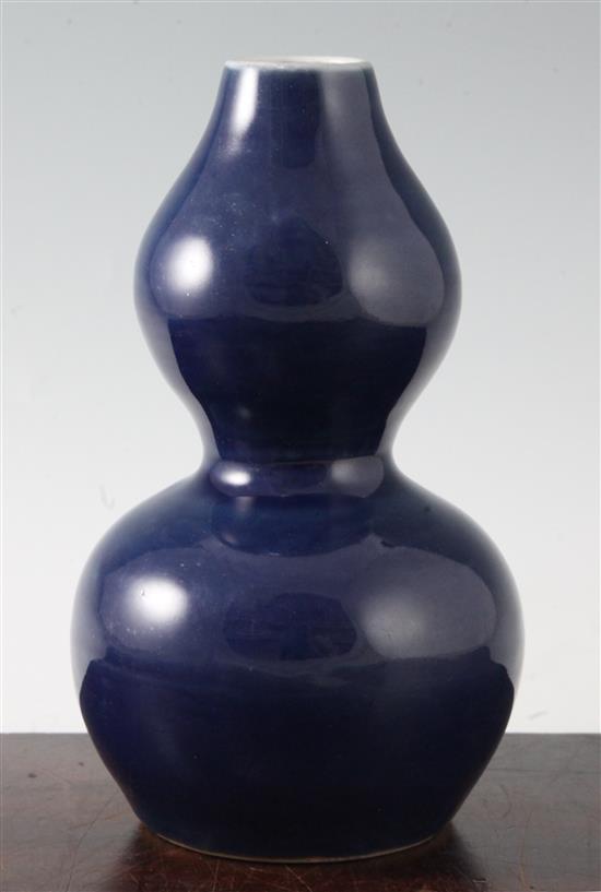 A Chinese blue monochrome double-gourd vase, Wanli six character mark and probably of the period, height 22.5cm